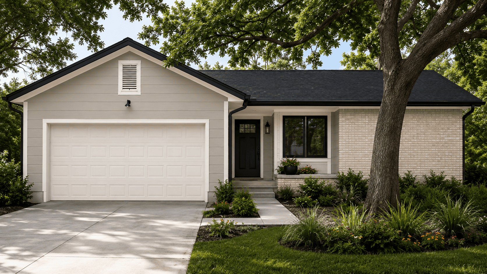 Exterior house painting on an Austin, TX home with light gray siding, white trim and garage door, a black front door, black window frames, and black gutters