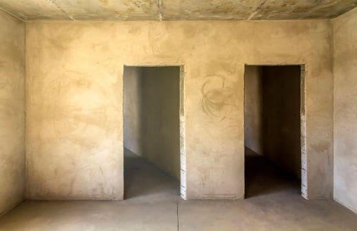 Comparison of a room in an apartment before and after renovation works. New house interior with plastered and painted walls, white doors and wooden oak floor. Real estate development concept.