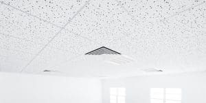 3d rendering of white ceiling in perspective with texture of acoustic gypsum board, air conditioner, lighting fixture or panel light, pattern of square grid structure. Interior design for building.