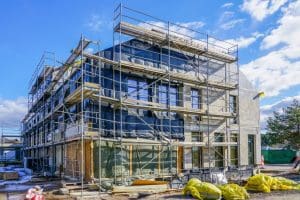 reconstruction of an old house with extension, scaffolding around the house