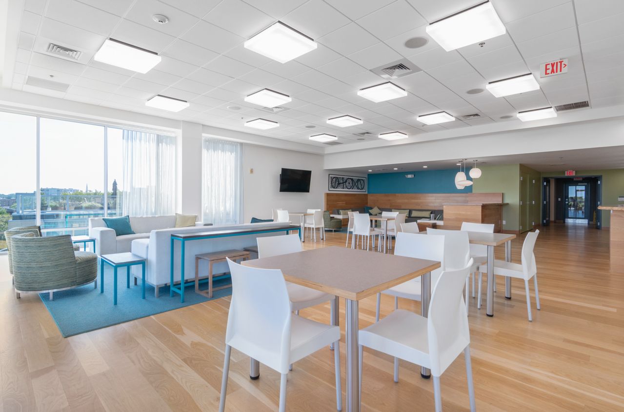 Drop ceiling installers finished suspended ceiling in an office lounge, Austin, TX
